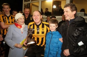 John Haran receives his Man of the Match award – the Peadar McGeehin Memorial trophy – from members of the McGeehin family on Sunday. Photo: Declan Doherty (courtesy of Donegal News)