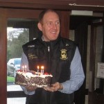 Mr Haran getting ready to blow out the candles on his cake.